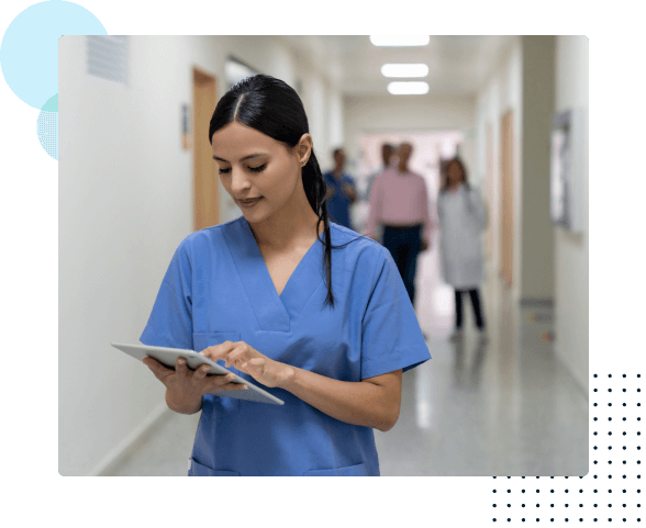 Nurse in hospital looking at a tablet - HealthStream